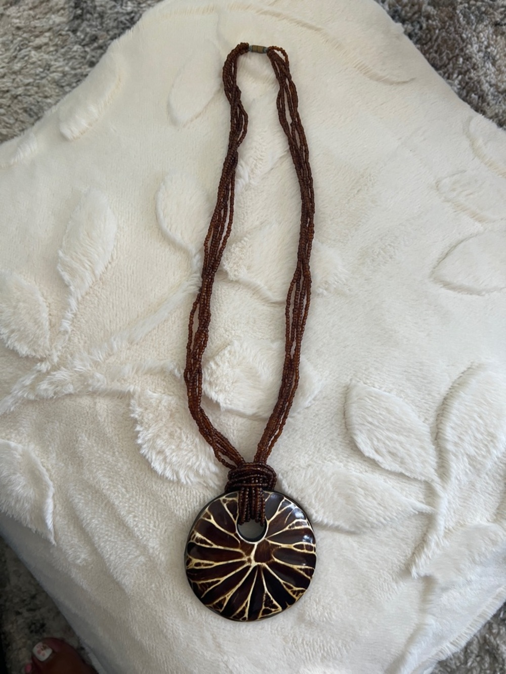 Brown Beaded Necklace with Round Carved Wooden Pendant